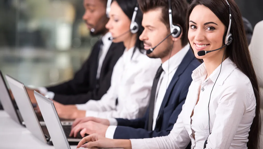 Call center representatives wearing headsets