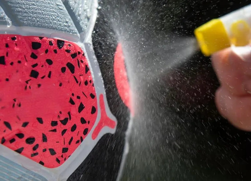 Person using a spray bottle